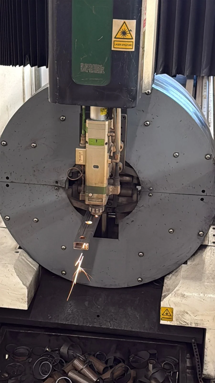 Close-up of laser technology precision engineering process with focused beam on metal surface
